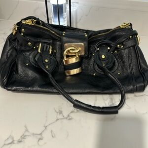 Black used padlock bag